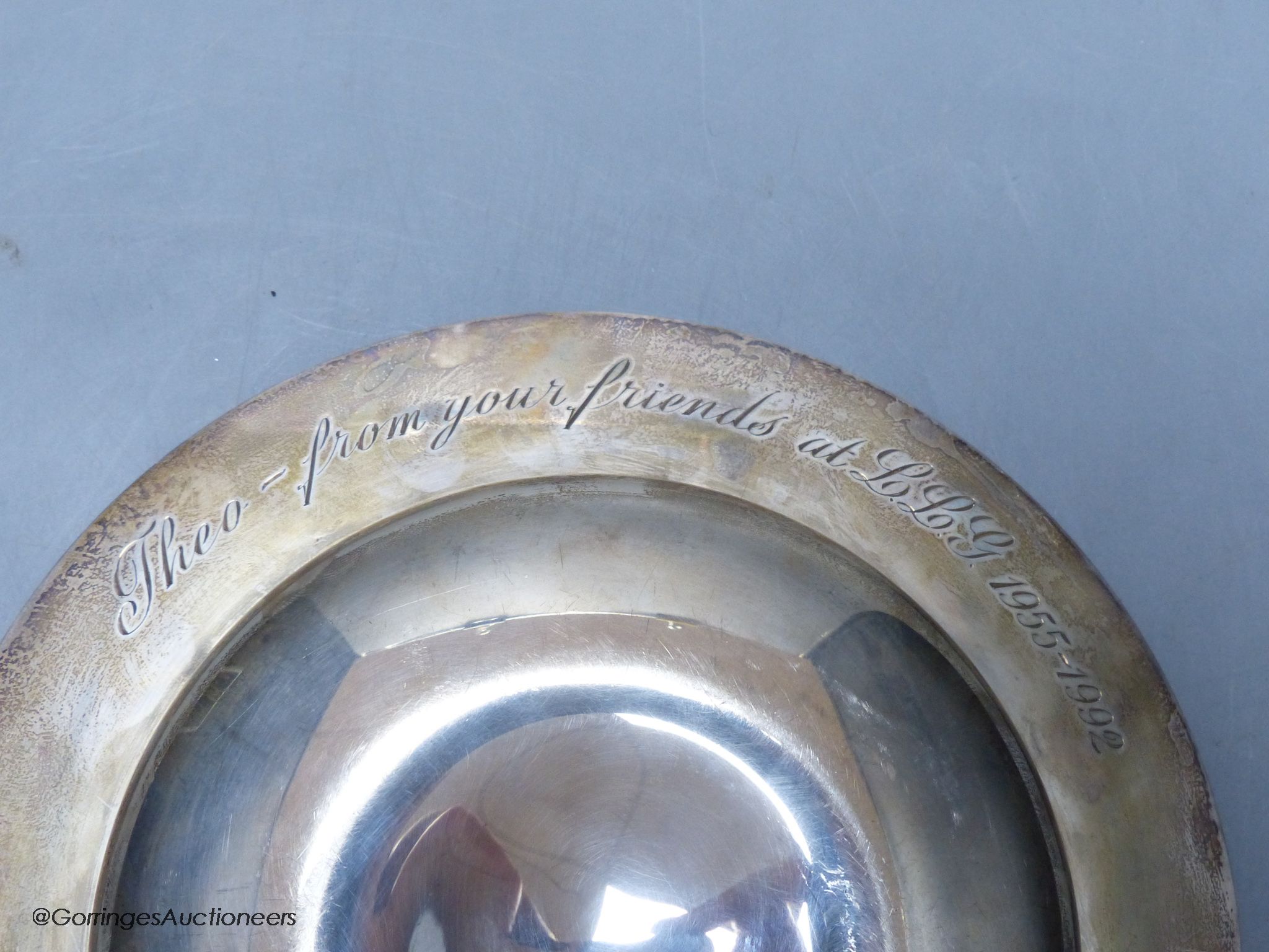 A Mappin & Webb circular silver presentation bowl, of plain line-engraved form, 11.24oz